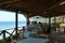 Prasoudi, Corfu, Greece, June 2019 Tourists eat lunch in a typical Greek tavern with sea view