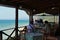 Prasoudi, Corfu, Greece, June 2019 Tourists eat lunch in a typical Greek tavern with sea view