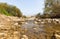 The Prat  River flows into the Jordan River near the Baptismal Site of Jesus Christ - Qasr el Yahud near to Jericho in Israel