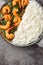 Prawn Saag or shrimp curry with spinach served with rice closeup on the plate on the table. Vertical top view