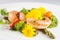 Prawns, asparagus and broccoli with edible daisy flowers