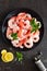 Prawns on plate. Shrimps, prawns. Seafood. Top view. Dark background