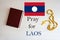 Pray for Laos. Rosary and Holy Bible background