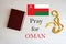 Pray for Oman. Rosary and Holy Bible background