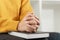 Pray and religion concept, Female christian hands folded on holy bible and praying to god