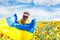 Pray for Ukraine. Child with Ukrainian flag