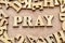 Pray word made with wooden letters