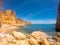 Praya de Marinha most beautiful beach in Algarve, Portugal. Cliffs on Coast of Atlantic ocean against blue sky