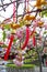 Prayer bells hung on pink cherry blossom tree