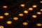 Prayer burning candles in a church on a dark background. Religious concept