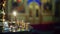Prayer candles. Candle holder in the Russian Orthodox Christian Church. Scene. Church candles in sand candlesticks on