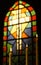 Prayer Candles And Stained Glass Church Window