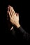 Prayer, hands and black background for hope, religion and faith or ask for help with worship or spiritual support in