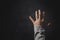 Prayer person hand in black background. Christian catholic woman are praying to god in dark at church. Girl believe and faith in