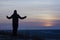 Prayer. Repentance. A man with his hands raised against the sky. Pray to God. Worship, against the backdrop of sunset