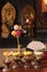 Prayer room of Gokokuji temple with lotus flowers, clementine and buddhist five colors paper flowers in golden vases.