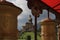 Prayer wheels with buddha statue at Tathagata Tsal Buddha Park in rsikkim India