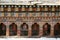 Prayer wheels were installed in the courtyard of a Buddhist temple in the countryside near Paro (Bhutan)