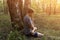 Prayer, yoga, meditation outdoors in forest in sunlight