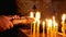 Prayers lighting candles in Holy Sepulcher Church