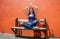 Praying beautiful girl enjoying relaxing on bench in yoga position