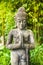 Praying Buddhist Statue Decorating a Meditation and Relaxation Temple Garden