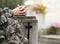 Praying in cemetery