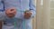 Praying hands of an old man with rosary beads