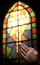 Praying Hands And Stained Glass Church Window