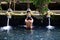 Praying in holy spring water of sacred pool at Pura Tirta Empul Temple