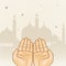 Praying human hands in front of Mosque for Ramadan Kareem celebration.