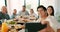 Praying, religion and big family at a lunch together at the table in the dining room of their home. Selfie, cheers and