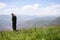 Praying senior in mountains