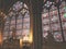 Praying Statue and Artistic Stained Glasses with Notre Dame Cathedral