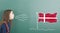 Pre-adolescent girl blowing on Denmark flag