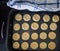 Pre-Baked butter biscuits in a baking tray