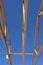 Pre-built rafters on a new garage roof against a bright blue sky