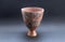 Pre-columbian ceramic vase called `Huaco` from Nazca, an ancient Peruvian culture.