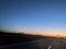 Pre-Dawn Palette: Silhouetted Horizon Along the Open Road