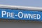 Pre-Owned Cars sign at a used car dealership. As supplies of new cars dwindle, used cars become more popular