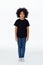 Pre-teen African American kid in casual style standing still