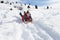 Pre-teen Boy On A Sled In The Snow