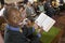 Preacher at altar holding open Bible in Front of Congregation portrait high angle view