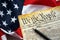 Preamble to the Constitution of the United States and American Flag close up