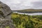 Precambrian Rock with Fall Colors and a Lake in the Background -