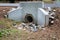 Precast concrete headwall for pipe running under a roadway, rainwater runoff culvert