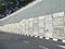 Precast concrete retaining wall panels are installed in layers as a retaining wall.