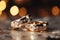 Precious bands Silver and gold wedding rings, bokeh background allure