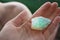 Precious stone, magic blue cristal in hand, mineral