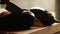 precise preparation: woman hands cutting eggplant into cubes on wooden board closeup